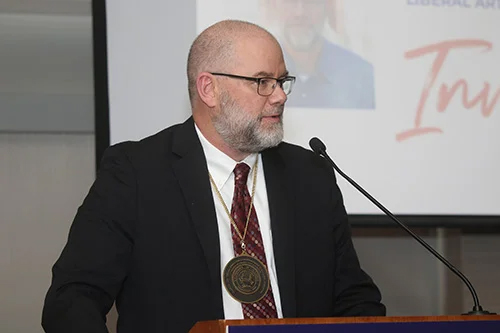 curtis perry at a lecturn
