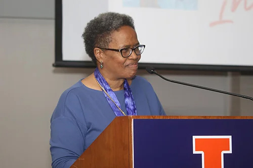 Janice Harrington speaking at a lecturn