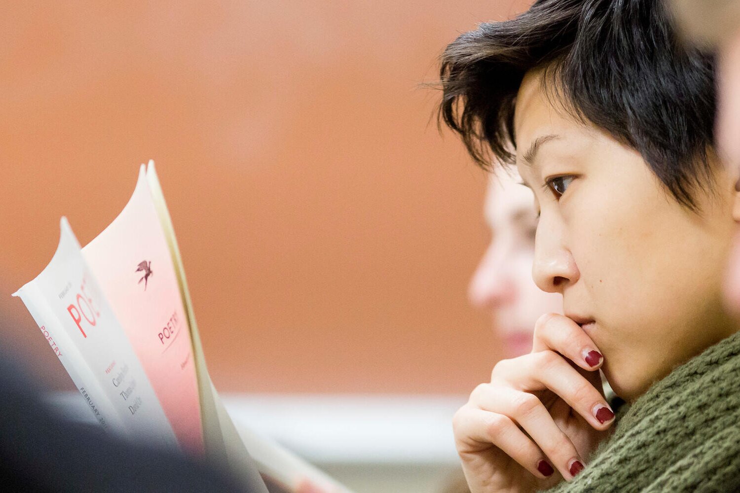 student reading poetry