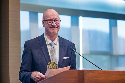 Professor Dean gives remarks during his investiture as the James M. Benson Professor in English
