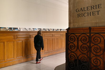 A person walking through Galerie Richet
