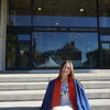 Riley parks sitting in front of the College of Education building