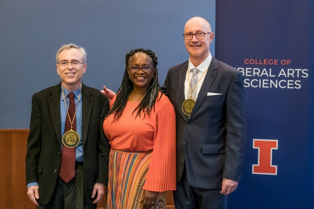 Professors Dean and Parker posing with College of LAS Dean Venetria Patton