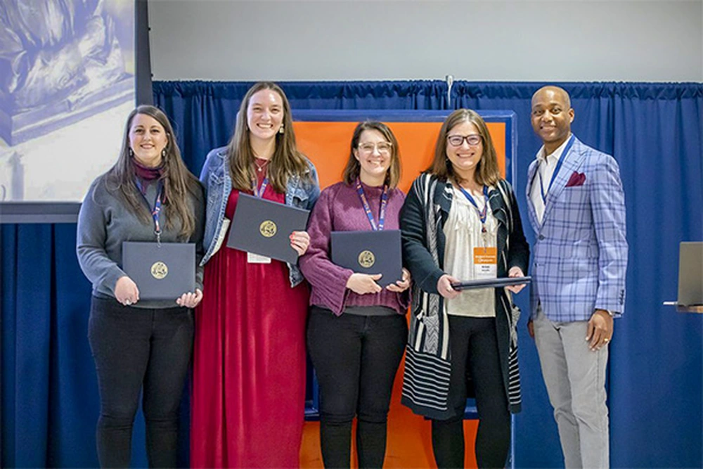 Rhetoric Program team members receiving award