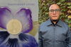 A photo of Angel Garcia next to the cover of his new poetry collection titled "Indifferent Cities"