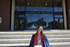 Riley parks sitting in front of the College of Education building